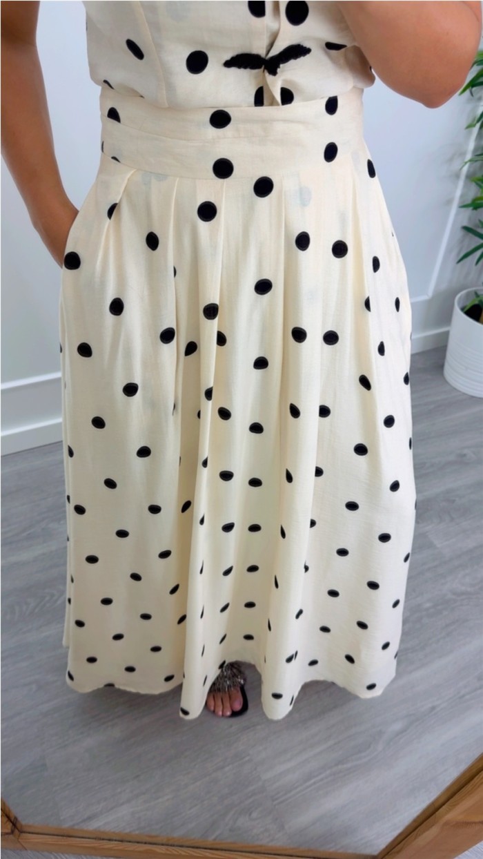 FALDA LARGA CINTURA ALTA FONDO BEIGE LUNAR EN NEGRO